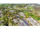 Aerial view of residences and a golf course in a wooded community with parking at 1545 Spinnaker Dr. # 2C, North Myrtle Beach, SC 29582