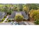 An aerial view of a well-maintained condominium complex surrounded by mature trees at 1545 Spinnaker Dr. # 2C, North Myrtle Beach, SC 29582