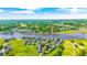 Aerial view showcases coastal community with homes nestled among waterways and lush greenery at 1545 Spinnaker Dr. # 2C, North Myrtle Beach, SC 29582