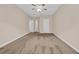 Bedroom featuring neutral walls and carpet, a ceiling fan, and a hallway entry at 1545 Spinnaker Dr. # 2C, North Myrtle Beach, SC 29582
