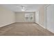 Bedroom features neutral carpet, ceiling fan, window, and closet at 1545 Spinnaker Dr. # 2C, North Myrtle Beach, SC 29582