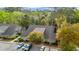 Exterior shot of a community building with parking and mature trees at 1545 Spinnaker Dr. # 2C, North Myrtle Beach, SC 29582
