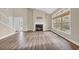 Spacious living room features fireplace, hardwood floors and natural light at 1545 Spinnaker Dr. # 2C, North Myrtle Beach, SC 29582