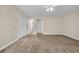 Spacious main bedroom showcasing carpet and several doors at 1545 Spinnaker Dr. # 2C, North Myrtle Beach, SC 29582