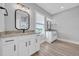 Bright bathroom with double sink vanity, granite countertops, and modern fixtures, offering both style and functionality at 186 Palmetto Harbour Dr., North Myrtle Beach, SC 29582