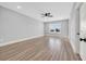 Bedroom with neutral walls, fan, hardwood floors, and a large window at 186 Palmetto Harbour Dr., North Myrtle Beach, SC 29582