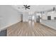 Spacious living space with hardwood floors, neutral walls, recessed lighting, and a view into the kitchen at 186 Palmetto Harbour Dr., North Myrtle Beach, SC 29582