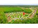 Scenic aerial view of a residential community, showcasing well-maintained homes and tree-lined streets in a peaceful setting at 232 Marbella Dr., Murrells Inlet, SC 29576
