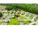 Aerial view of a charming home nestled among lush greenery, showcasing a well-manicured lawn and inviting neighborhood at 232 Marbella Dr., Murrells Inlet, SC 29576