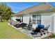 Backyard patio featuring a hot tub, table, lounge chairs, and grill at 232 Marbella Dr., Murrells Inlet, SC 29576