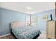 Cozy bedroom featuring blue walls, a comfortable bed, and lots of natural light at 232 Marbella Dr., Murrells Inlet, SC 29576