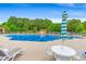 Inviting community pool with lounge chairs and umbrellas, perfect for relaxation at 232 Marbella Dr., Murrells Inlet, SC 29576