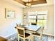 Inviting dining area with a window providing ample natural light and a table set for a meal at 232 Marbella Dr., Murrells Inlet, SC 29576