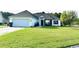 Charming single-story home featuring a well-manicured lawn and an attached two-car garage at 232 Marbella Dr., Murrells Inlet, SC 29576