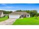 Charming single-story home with a well-kept lawn, attached garage, and inviting entryway, presenting curb appeal at 232 Marbella Dr., Murrells Inlet, SC 29576