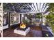 Stylish outdoor lounge area with a cozy fire pit and comfortable seating at 232 Marbella Dr., Murrells Inlet, SC 29576