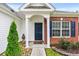 Close-up of the front entrance with brick facade and a cozy, welcoming doormat at 232 Marbella Dr., Murrells Inlet, SC 29576