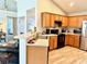 Modern kitchen with stainless steel appliances, wooden cabinets, and ample counter space at 232 Marbella Dr., Murrells Inlet, SC 29576