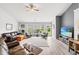 Bright living room featuring wood-look floors, large windows, and stylish furniture arrangement at 232 Marbella Dr., Murrells Inlet, SC 29576