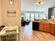 Open-concept living area with dining, kitchen, and living room with abundant natural light and comfortable furnishings at 232 Marbella Dr., Murrells Inlet, SC 29576