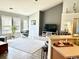 Bright and airy living room with large windows, modern decor, and comfortable seating at 232 Marbella Dr., Murrells Inlet, SC 29576