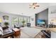 Open concept living room with vaulted ceilings, TV, and modern decor elements at 232 Marbella Dr., Murrells Inlet, SC 29576