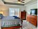 Spacious main bedroom features a tray ceiling, large windows, and ample natural light at 232 Marbella Dr., Murrells Inlet, SC 29576