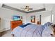 Relaxing main bedroom with a large bed, TV, and access to an en-suite bathroom at 232 Marbella Dr., Murrells Inlet, SC 29576
