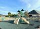 Community playground with slide and climbing structure for enjoyment at 232 Marbella Dr., Murrells Inlet, SC 29576