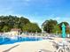 Community pool with surrounding lounge chairs and lush greenery at 232 Marbella Dr., Murrells Inlet, SC 29576