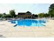 Expansive community pool with ample seating and a well-maintained pool deck at 232 Marbella Dr., Murrells Inlet, SC 29576