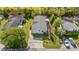 Overhead view of a single-story home with a grey roof, concrete driveway and beautifully manicured lawn at 499 Folly Estates Dr., Myrtle Beach, SC 29588