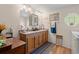 Bathroom with a double sink vanity, wood accents, and a stylish mirror at 499 Folly Estates Dr., Myrtle Beach, SC 29588