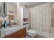 Bright bathroom with a granite countertop sink, vanity, seashell decor, and shower-tub combo at 499 Folly Estates Dr., Myrtle Beach, SC 29588