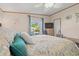 Comfortable bedroom featuring a window with a peaceful view of the outdoors and modern ceiling fan at 499 Folly Estates Dr., Myrtle Beach, SC 29588