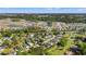 Aerial view of a residential community surrounded by lush greenery and tranquil ponds at 499 Folly Estates Dr., Myrtle Beach, SC 29588