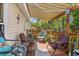 Inviting deck includes comfortable seating, sun shade, and beautiful outdoor views for relaxing and entertaining at 499 Folly Estates Dr., Myrtle Beach, SC 29588