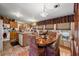 Open concept dining area with a wooden table, chairs, and a view of the kitchen at 499 Folly Estates Dr., Myrtle Beach, SC 29588
