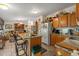 Charming kitchen with granite countertops, wood cabinets, and an island with seating at 499 Folly Estates Dr., Myrtle Beach, SC 29588
