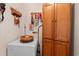 Efficient laundry area with cabinetry, a clothes hamper, and decor at 499 Folly Estates Dr., Myrtle Beach, SC 29588