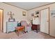 Comfortable living room with a mini fridge, floral easy chair, and plenty of storage space at 499 Folly Estates Dr., Myrtle Beach, SC 29588