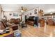 A cozy living room with hardwood floors, comfortable leather sofas, and a ceiling fan at 499 Folly Estates Dr., Myrtle Beach, SC 29588