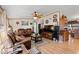 A cozy living room with hardwood floors, comfortable leather sofas, and a ceiling fan at 499 Folly Estates Dr., Myrtle Beach, SC 29588