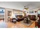 Cozy living room with hardwood floors, ceiling fan, and comfortable leather furniture at 499 Folly Estates Dr., Myrtle Beach, SC 29588