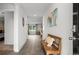 Inviting entryway with wood-look flooring, a bench with decorative pillows, and access to various living spaces at 5175 Yellowstone Dr., Conway, SC 29526