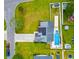 Aerial view of the home with a swimming pool, solar panels, lush landscaping and a fenced yard at 601 Seth Ln., Longs, SC 29568