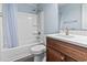 Bathroom with blue walls, updated fixtures, and a vanity sink with marble countertop at 601 Seth Ln., Longs, SC 29568