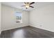 Bedroom with wood flooring, neutral paint, a ceiling fan, and natural light coming through the window at 601 Seth Ln., Longs, SC 29568