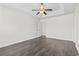A spacious bedroom featuring wood flooring, a ceiling fan, and a neutral color palette at 601 Seth Ln., Longs, SC 29568