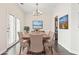 A dining room with a table and chairs and beach pictures on the wall at 601 Seth Ln., Longs, SC 29568